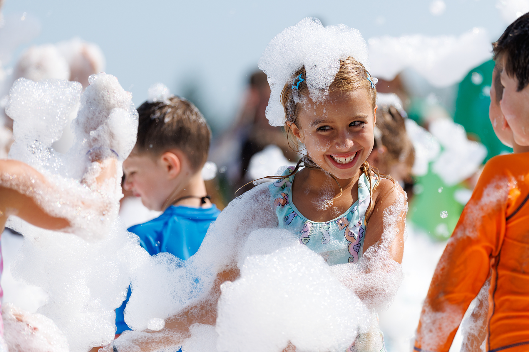 A child smiling while having fun at Camp Centerland.