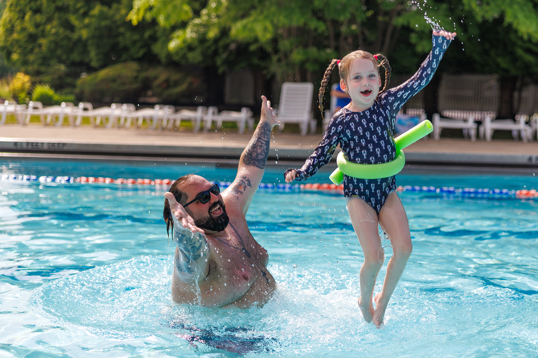 A JCC Buffalo swim instructor and child having fun during a swim lesson.